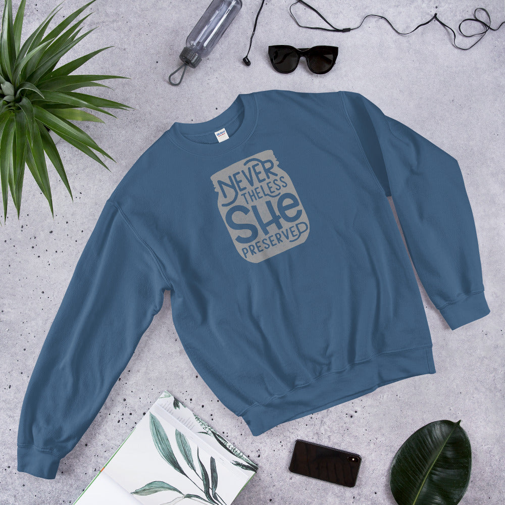 A Nevertheless She Preserved Comfy Sweatshirt by The Purposeful Pantry with the words 'never let her go' on it.