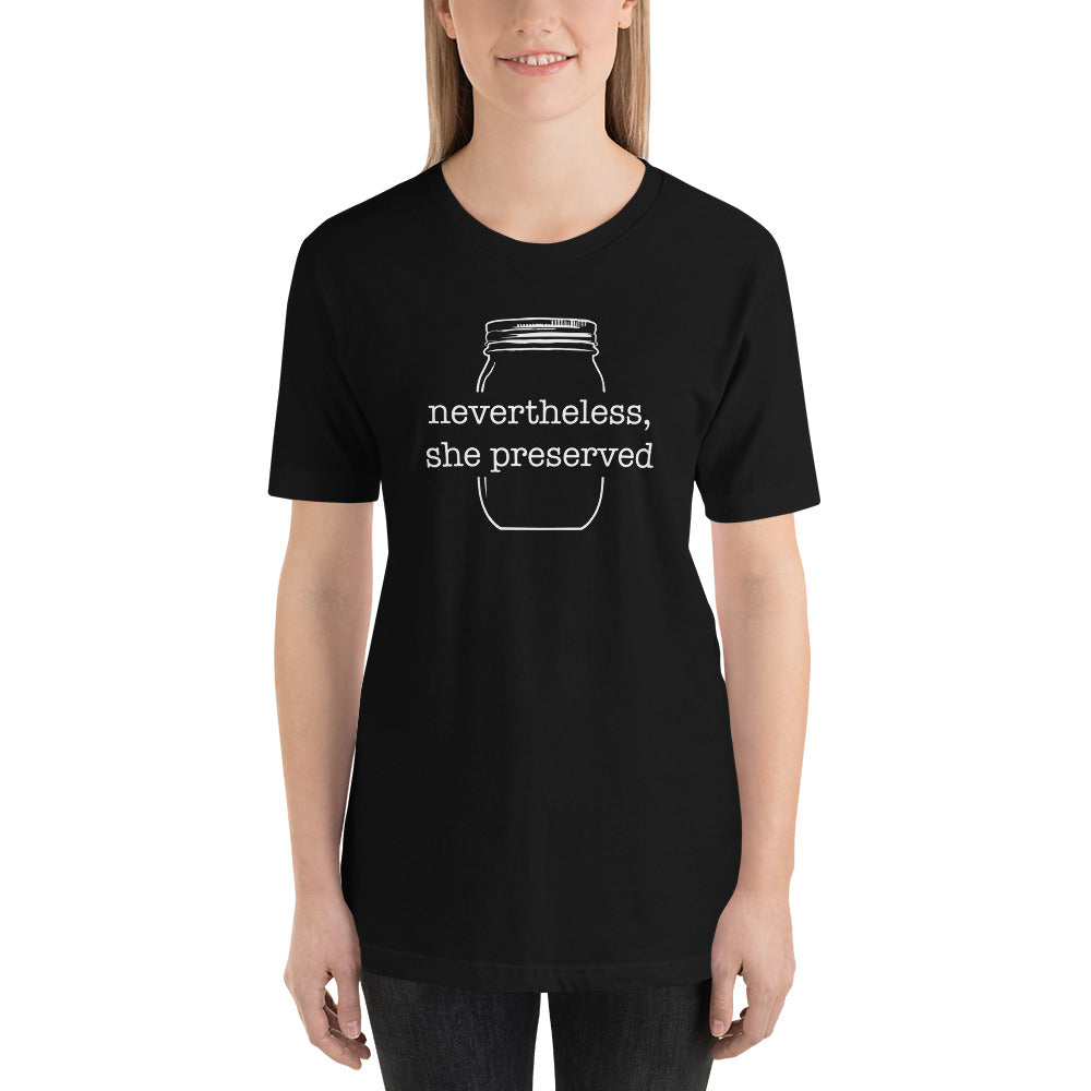 A woman wearing a black t-shirt that says "Nevertheless, She Preserved v 2" by The Purposeful Pantry she possessed.