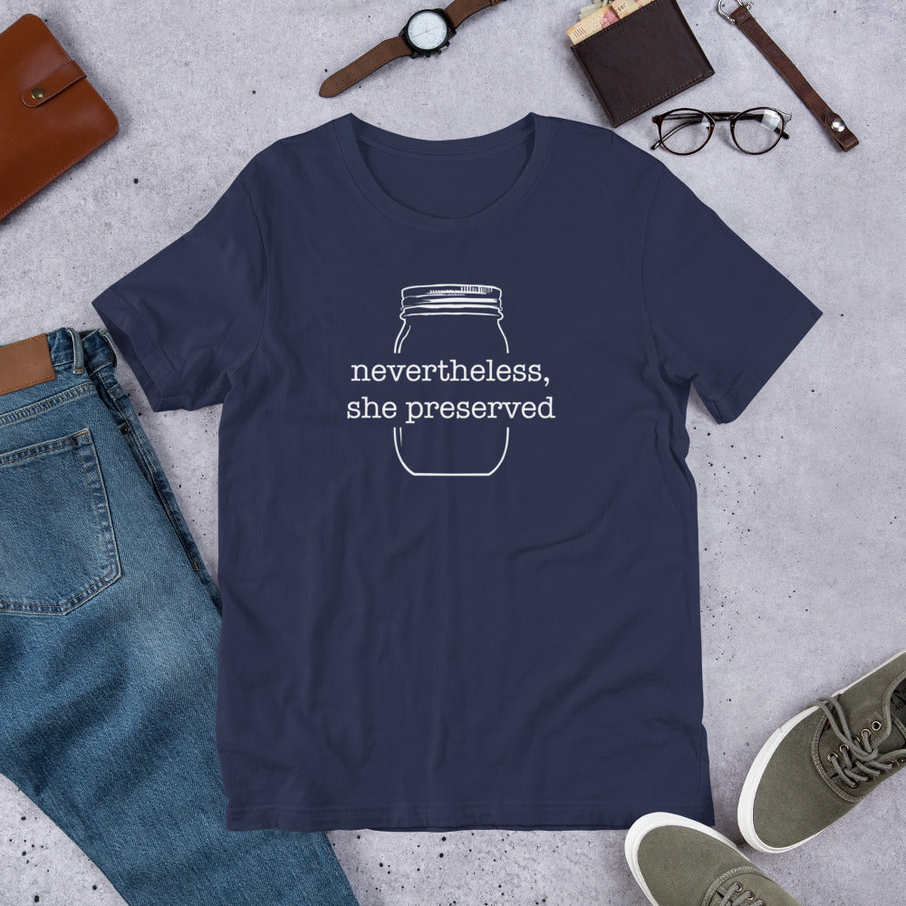 A navy unisex Nevertheless, She Preserved v 2 Short-Sleeve T-Shirt with a mason jar and a pair of shoes from The Purposeful Pantry.