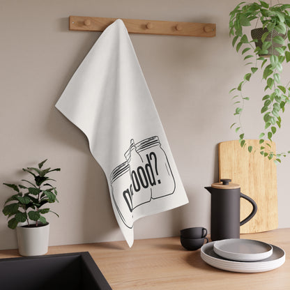 The Got Food? Kitchen Tea Towel by Printify hangs from a wooden peg rack above a sink, adding quirky decor to the kitchen alongside plants, a coffee pot, cups, and plates on the counter.