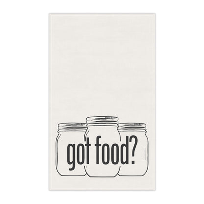 The Printify Got Food? Kitchen Tea Towel is a white towel featuring three illustrated mason jars with "got food?" in bold black letters—ideal kitchen decor for any home chef.
