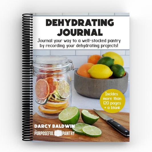 The Purposeful Pantry's Dehydrating Journal Spiral cover with lemons and oranges.