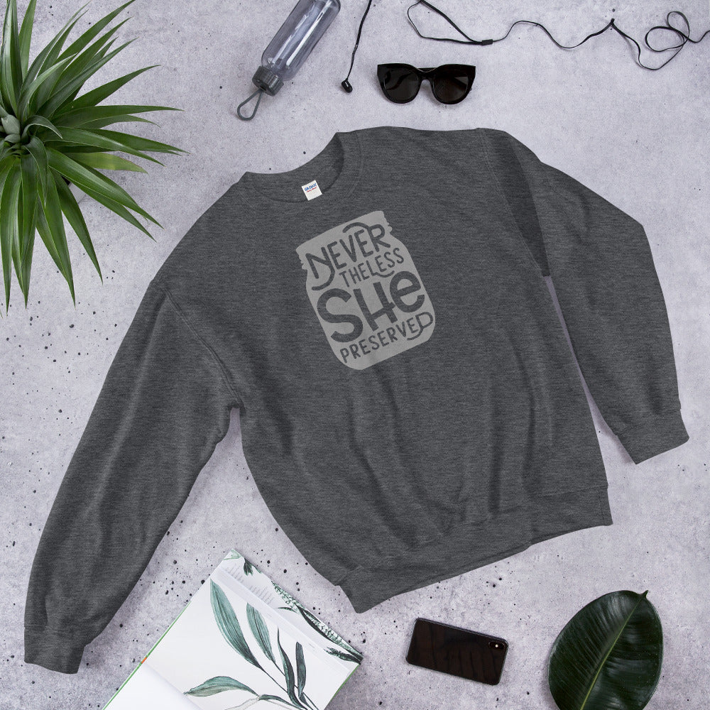 A grey sweatshirt with the words, "Nevertheless She Preserved" by The Purposeful Pantry.