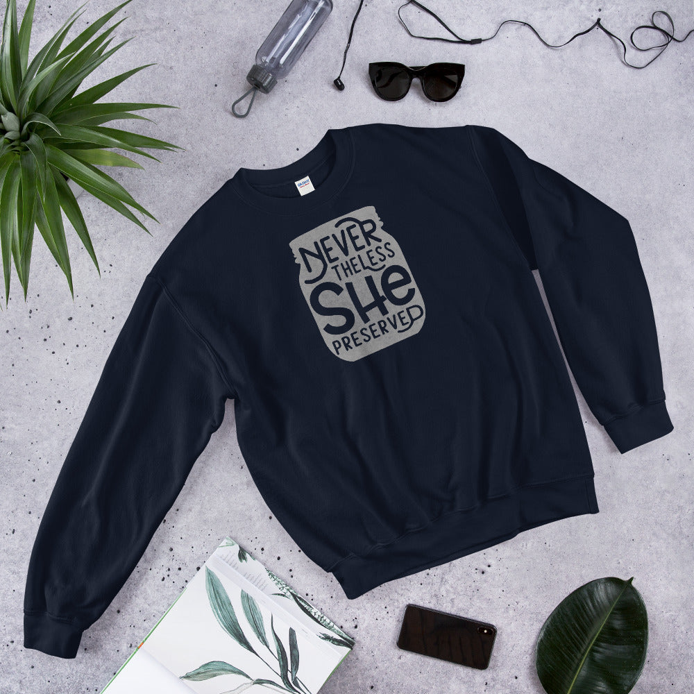 A navy Nevertheless She Preserved Comfy Sweatshirt with the words, she's the one by The Purposeful Pantry.